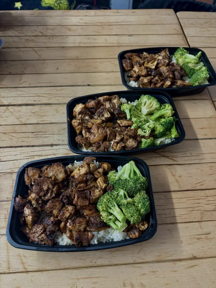 Big Chicken meal prep boxes with rice and broccoli